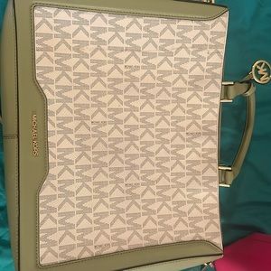 Olive green with MK all over it Michael Kors, medium to large cross body